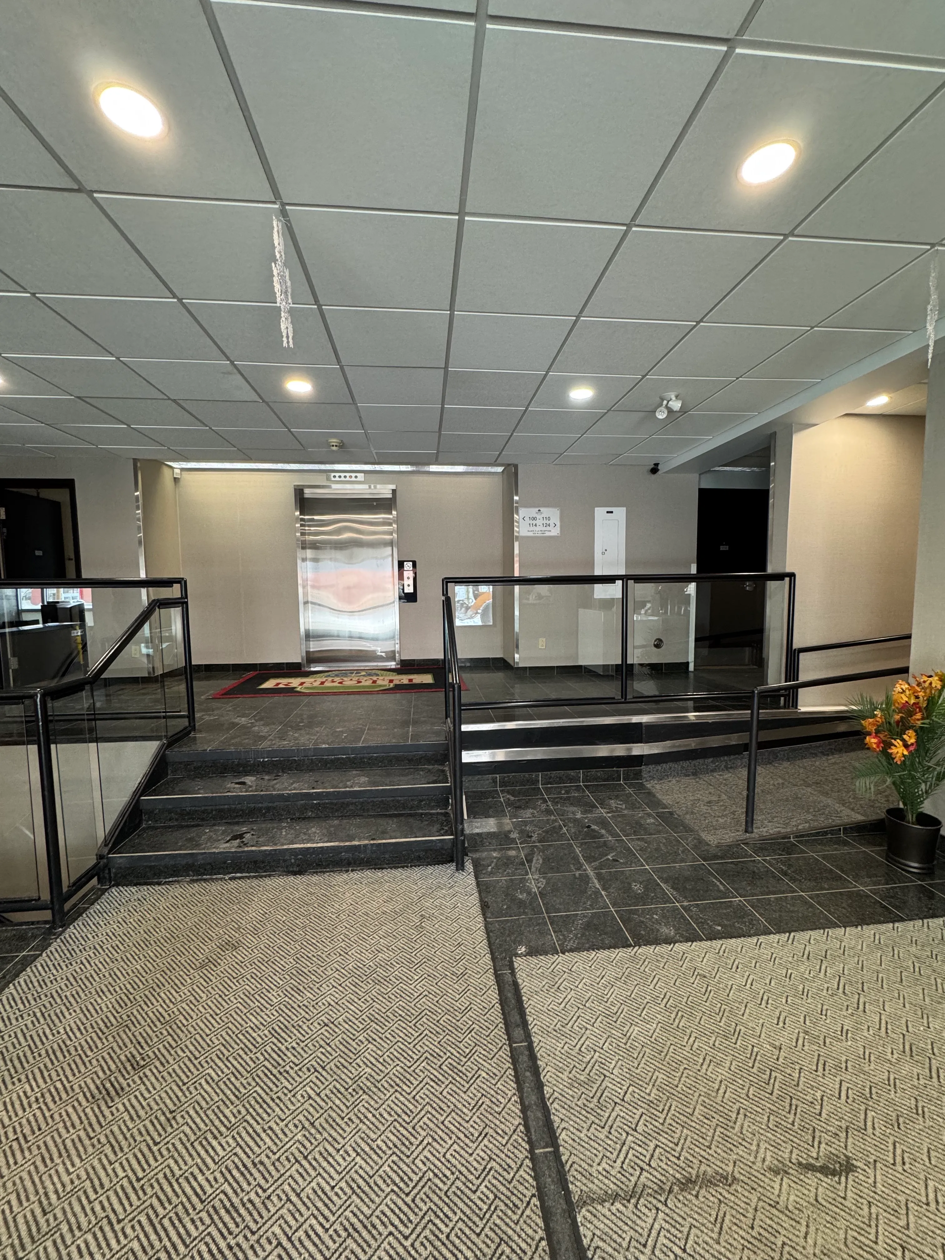 Access ramp and stairs to the elevator and rooms