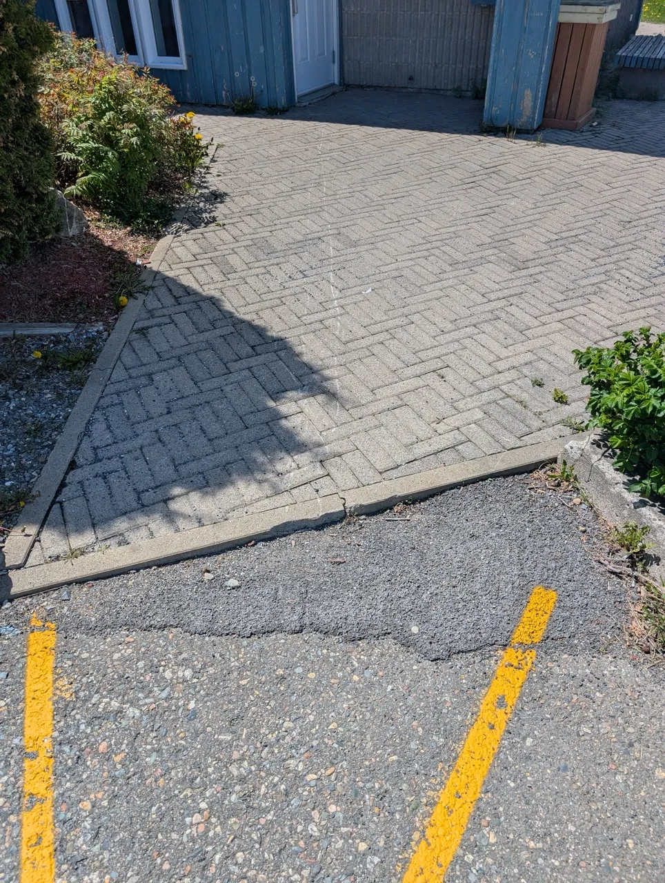 Pathway between the reserved parking area and the entrance