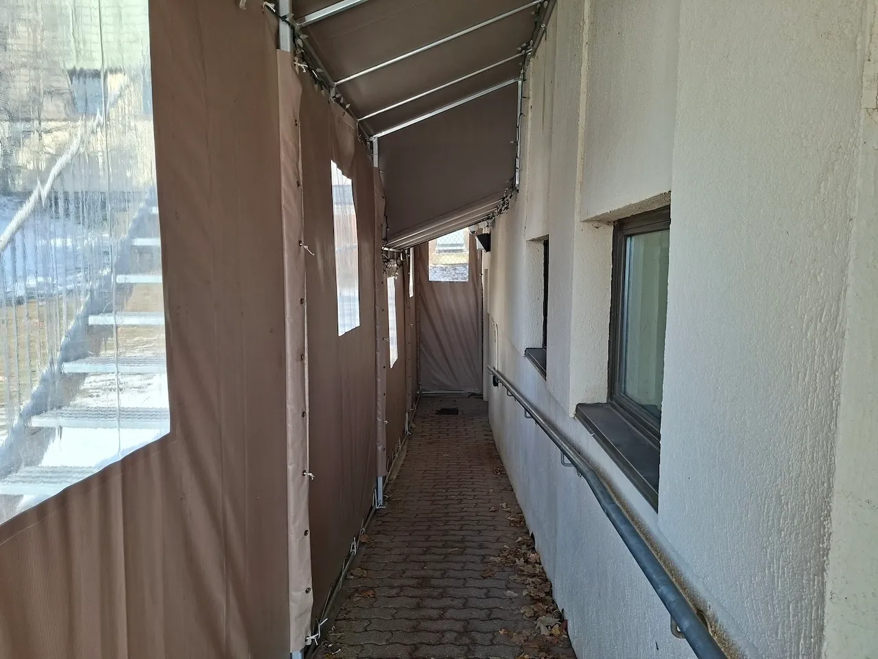 Secondary entrance - Located outside on the left - Access to the basement