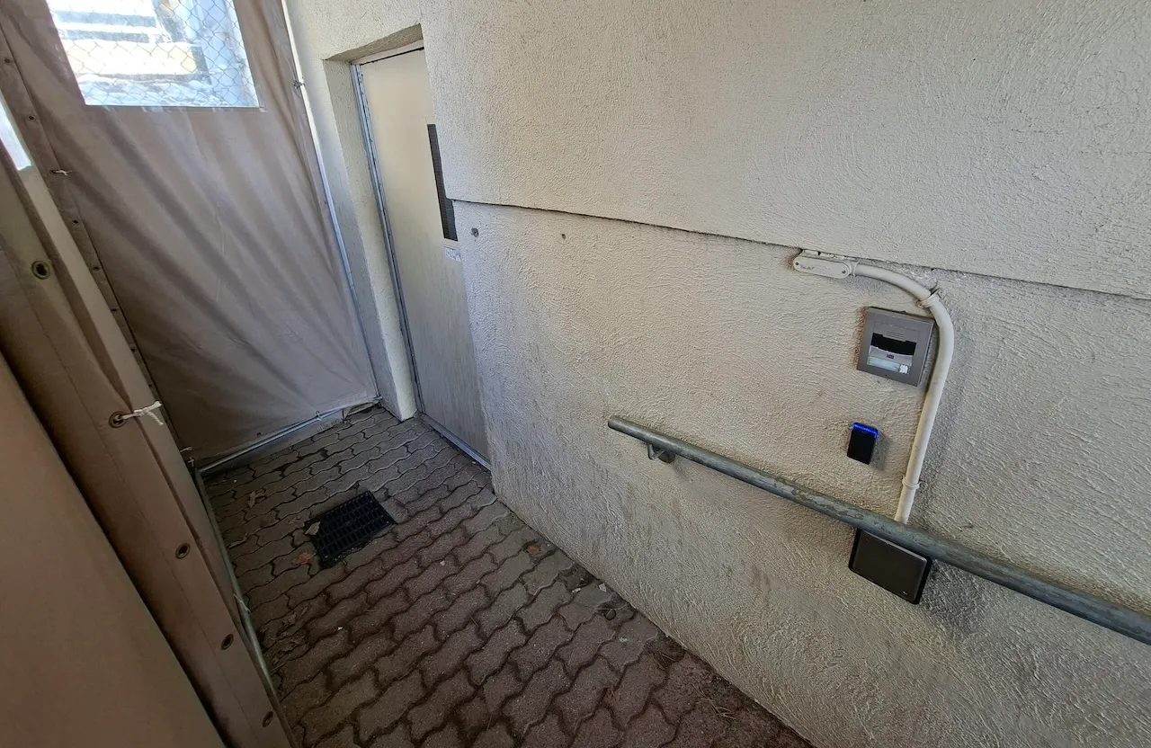 Secondary entrance - Located outside on the left - Access to the basement