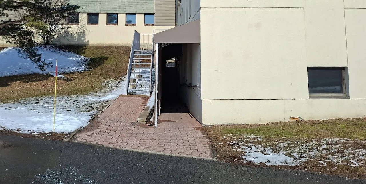 Secondary entrance - Located outside on the left - Access to the basement
