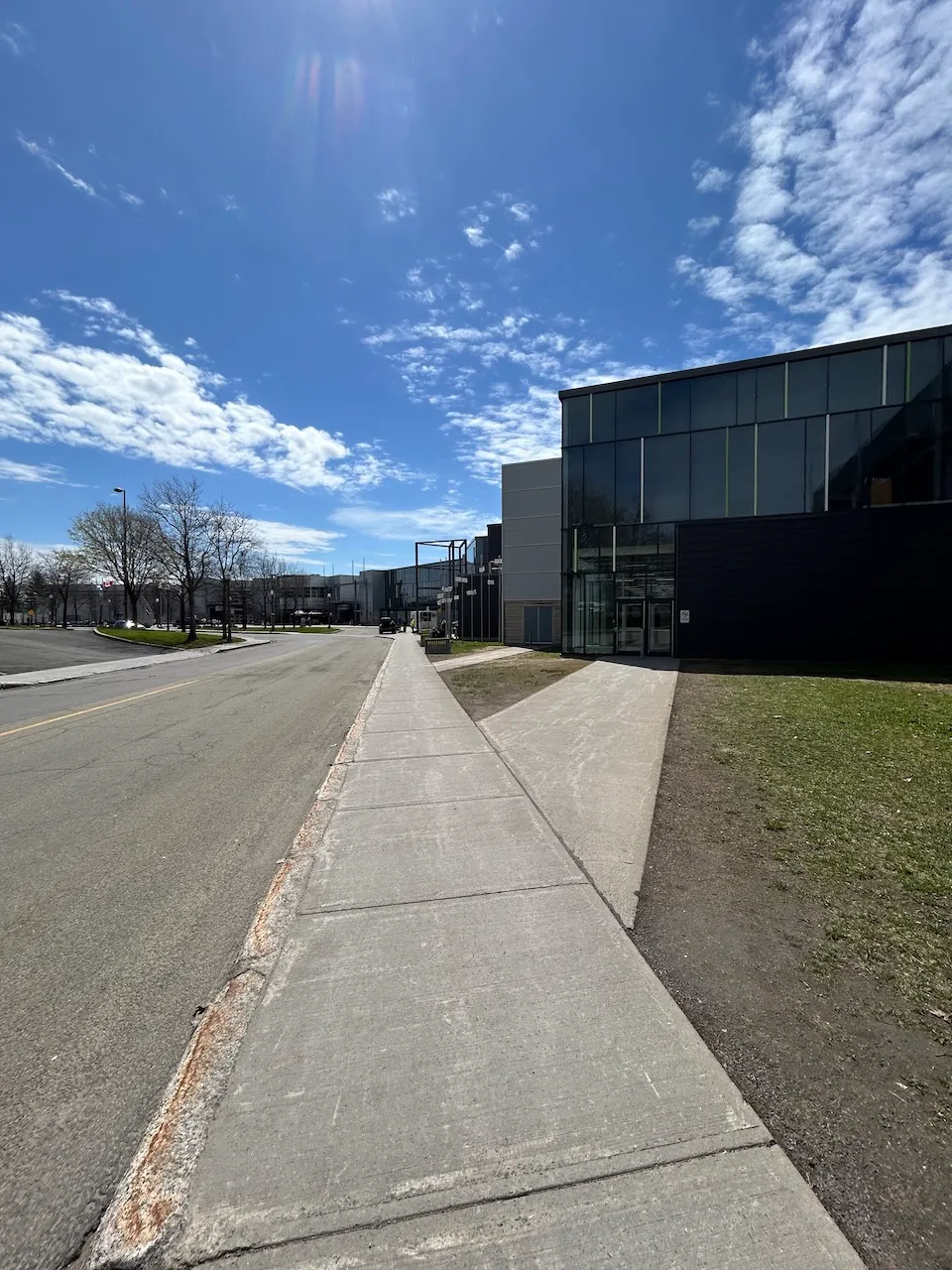 Entrance located near the parking lot and path leading to the other entrances