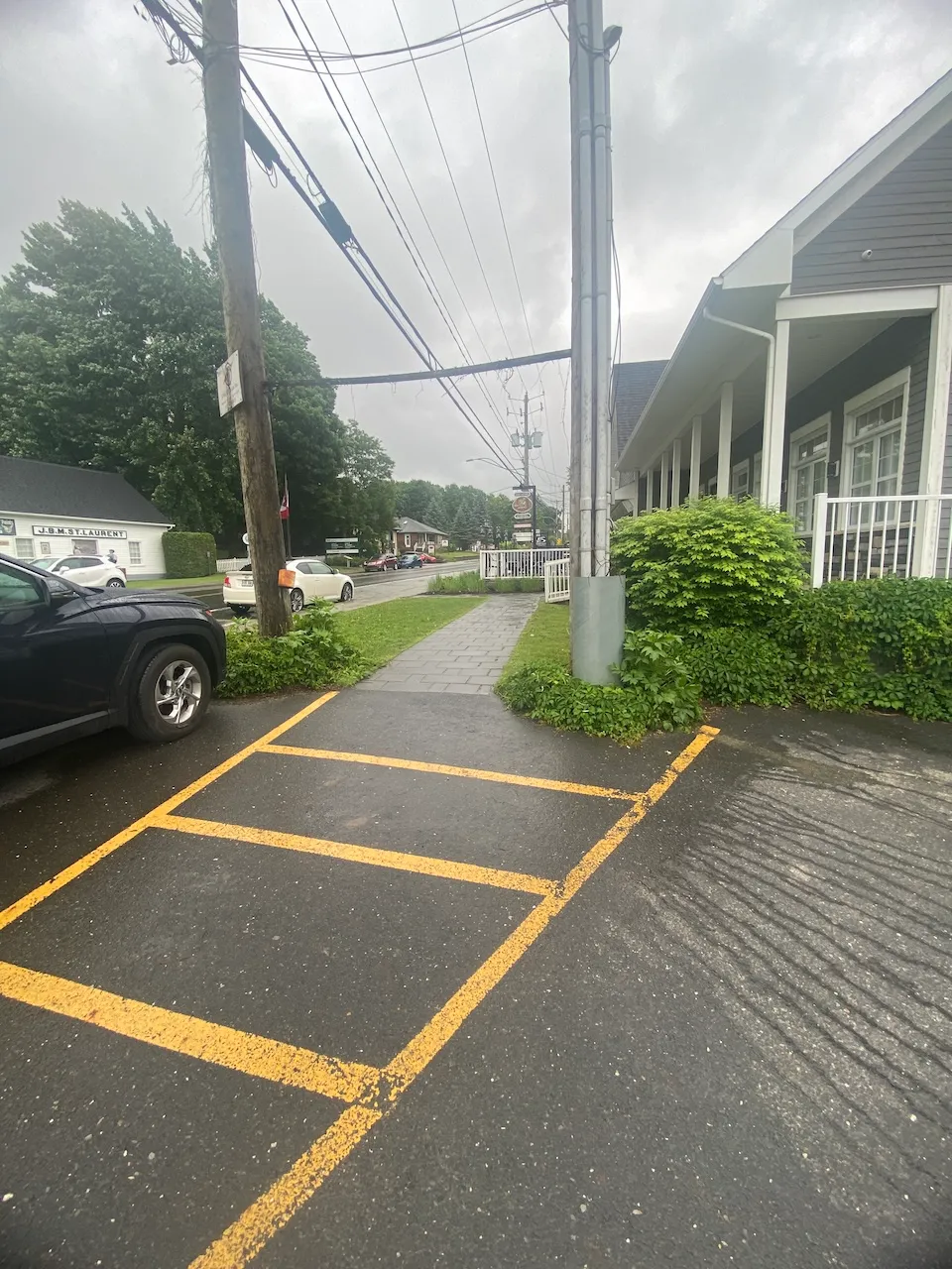 A path leading to the reserved parking area at the entrance.